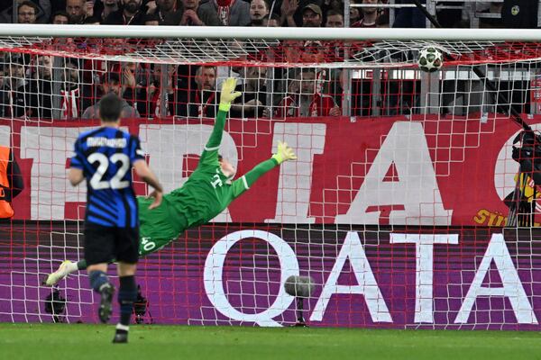 Inter Milan's Lautaro Martinez, not pictured, scores past Bayern's goalkeeper Jonas Urbig during the Champions League quarterfinals first leg soccer match between FC Bayern Munich and Inter Milan, at the Allianz Arena in Munich, Germany, Tuesday, April 8, 2025. (Peter Kneffel/dpa via AP)