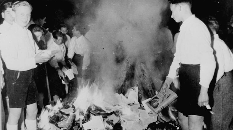 A Georgia Southern student who blasted a Latina author during a campus appearance asked the woman the purpose of her visit. Later that night, students burned the author’s book to protest its discussion of white privilege. This week, faculty are attempting to explain the purpose of the author’s visit, as well as the vile history of book burning by the Nazis, as shown in this historic news photo. These youngsters, members of the Hitler Youth, are burning books condemned as Jewish-Marxist in Salzburg, Austria, on April 30, 1938.