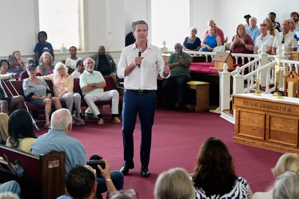 Gov. Gavin Newsom, D-Calif., gives remarks to a crowd at St. Paul First Baptist Church on Wednesday, July 9, 2025, in Laurens, S.C. (AP Photo/Meg Kinnard)