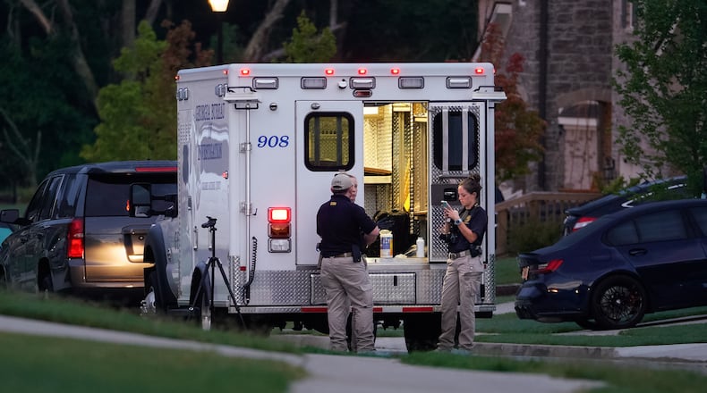 GBI technicians work the scene of an officer-involved shooting in Hall County on Wednesday morning. Hall sheriff's deputies were performing a wellness check at a home on Long Creek Drive when the shooting occurred.