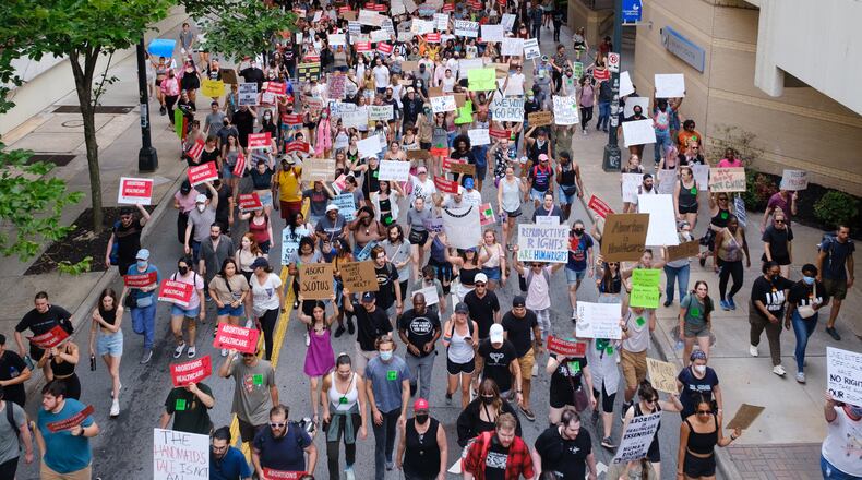 Abortion rights activists marched to Underground Atlanta from the Georgia Capitol on Friday, June 24, 2022. The protest followed the Supreme Court ruling in Dobbs, which overturned Roe v Wade. (Arvin Temkar / arvin.temkar@ajc.com)