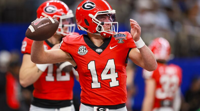 Georgia Bulldogs quarterback Gunner Stockton warms up before the NCAA College Football Playoff quarterfinal game against Ole Miss at the Sugar Bowl in the Caesars Superdome, Thursday, Jan. 1, 2026, in New Orleans. (Jason Getz/AJC)