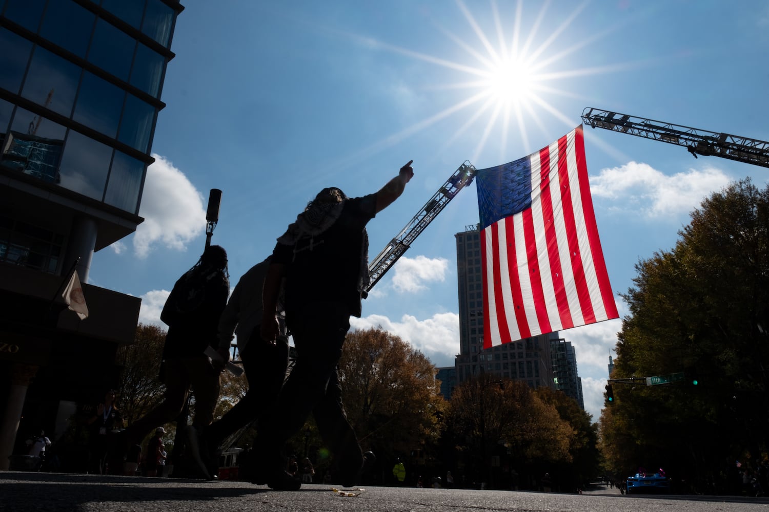 Veterans For Peace pass the reviewing stand during the Georgia Veterans Day Parade in Midtown Atlanta on Saturday, Nov. 8, 2025.   Ben Gray for the Atlanta Journal-Constitution