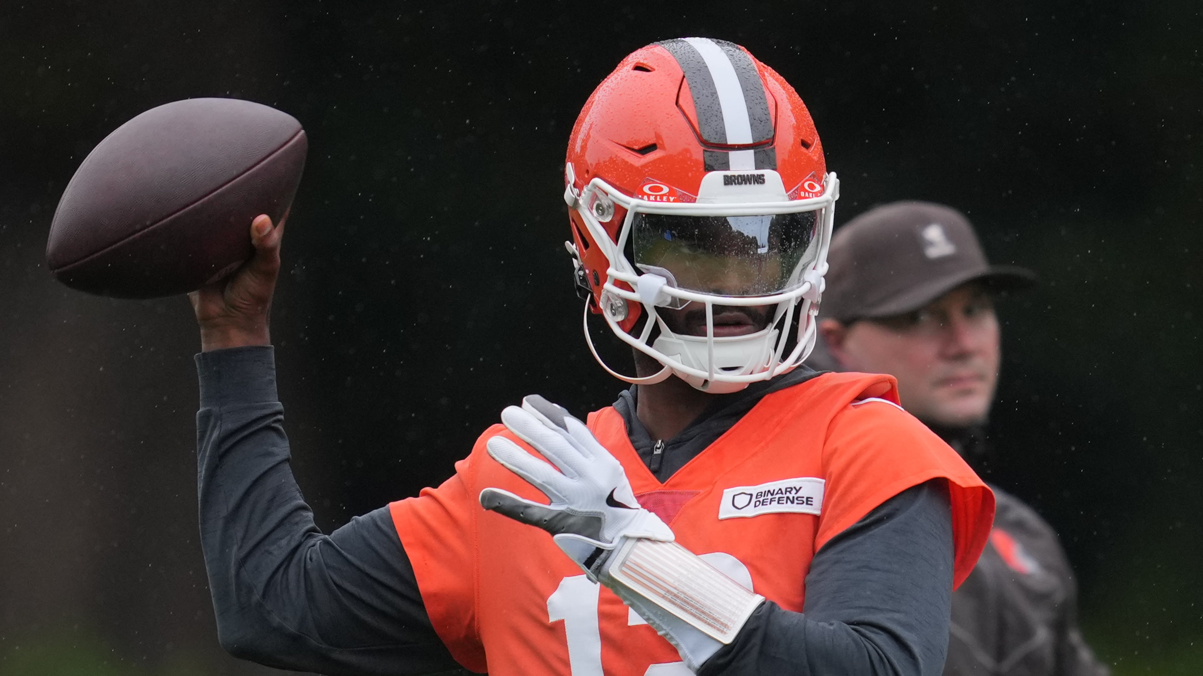 Cleveland Browns quarterback Shedeur Sanders (12) attends an NFL football practice at The Grove in Watford, England, Friday, Oct. 3, 2025. (AP Photo/Kin Cheung)