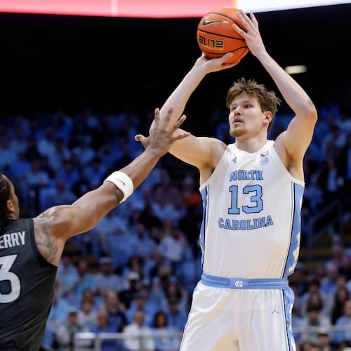 North Carolina center Henri Veesaar (13) shoots as Virginia Tech forward Amani Hansberry (13) defends during the first half of an NCAA college basketball game Saturday, Feb. 28, 2026, in Chapel Hill, N.C. (Chris Seward/AP)
