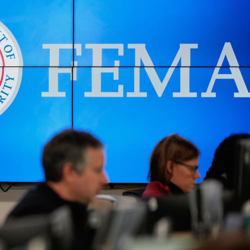 FILE - People work at the Federal Emergency Management Agency headquarters in Washington, Jan. 24, 2026. (AP Photo/Julia Demaree Nikhinson, File)