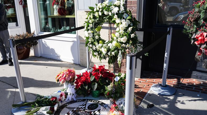 Flowers are displayed at the NC Auto Racing Walk of Fame for Greg Biffle, Friday, Dec. 19, 2025, in Mooresville, N.C. (AP Photo/Matt Kelley)