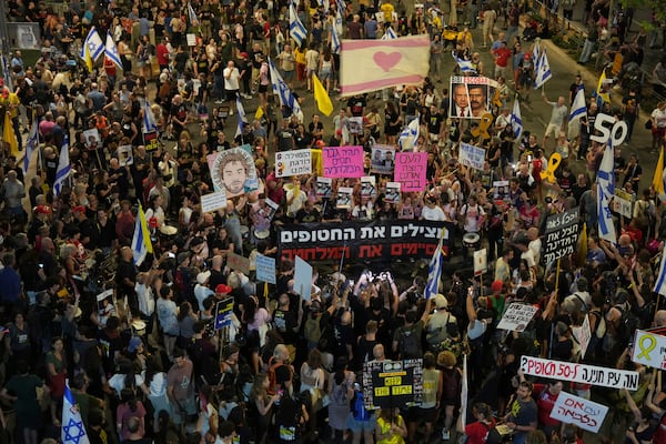 People take part in a protest demanding the end of the war and immediate release of hostages held by Hamas in the Gaza Strip, and against Prime Minister Benjamin Netanyahu's government in Tel Aviv, Israel, Saturday, June 28, 2025. (AP Photo/Ariel Schalit)