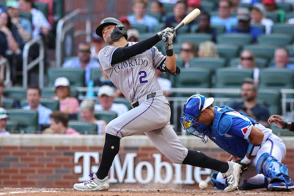 Colorado Rockies' Tyler Freeman (2) swings and misses at a pitch in the fifth inning of a baseball game against the Atlanta Braves, Saturday, June 14, 2025, in Atlanta. (AP Photo/Colin Hubbard)