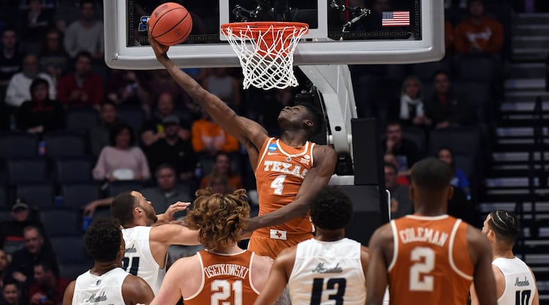 Mar 16, 2018; Nashville, TN, USA; Texas Longhorns forward Mohamed Bamba (4) shoots against the Nevada Wolf Pack during the first half in the first round of the 2018 NCAA Tournament at Bridgestone Arena. Mandatory Credit: Christopher Hanewinckel-USA TODAY Sports ORG XMIT: USATSI-378331 ORIG FILE ID: 20180316_ajw_ah2_085.jpg