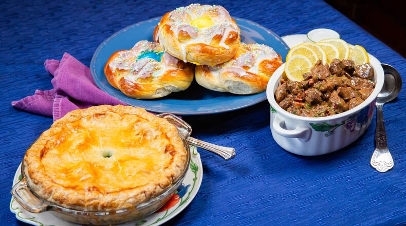 Three traditional Italian Easter dishes, from left: Torta Pasqualina (Easter Pie), Pane di Pasqua (Easter Bread), and Agnello Brodettato (Lamb Stew). Styling by Cynthia Graubart. (RYAN FLEISHER FOR THE ATLANTA JOURNAL-CONSTITUTION)