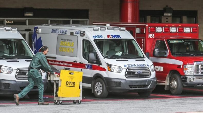 Ambulances are lined up at Grady Memorial Hospital. Photo: JOHN SPINK/JSPINK@AJC.COM