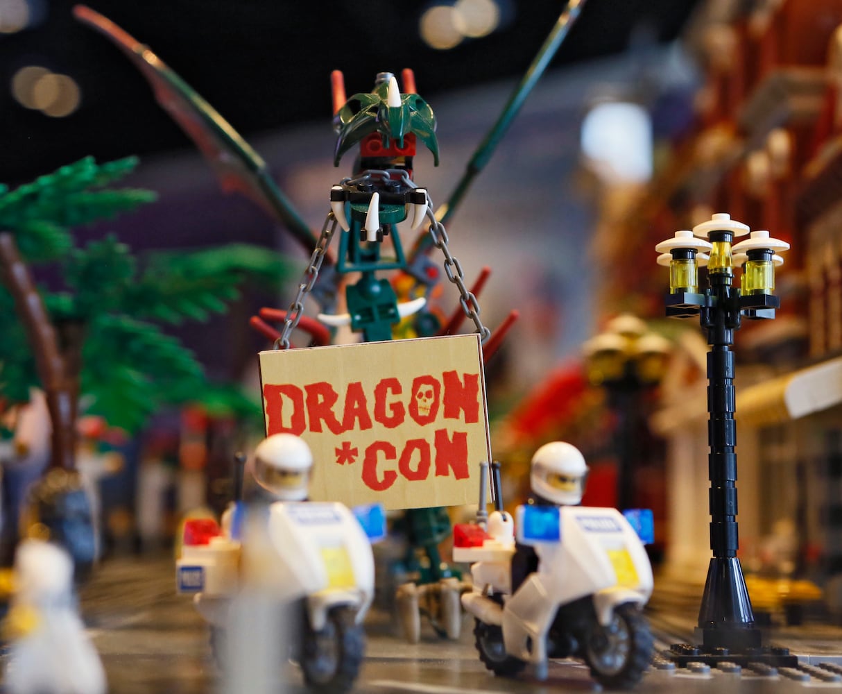 Father and son build giant Lego cityscape