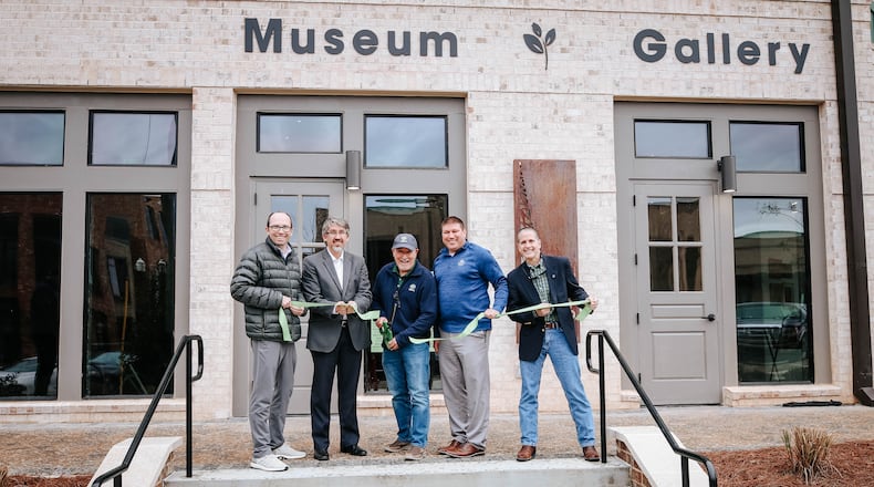Members of the Sugar Hill City Council celebrate the opening of the city's downtown art gallery and history museum with a ribbon-cutting ceremony on Feb. 25, 2021. (Courtesy City of Sugar Hill)