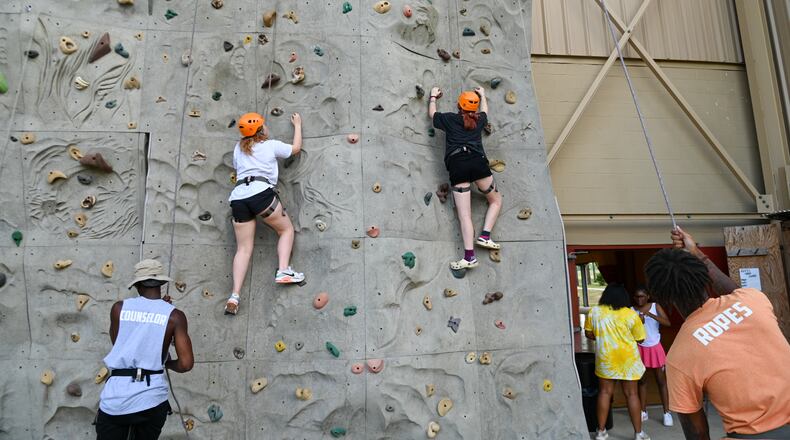 Campers climb the rock wall at a recent session of Camp Kudzu for kids and teens with Type 1 diabetes. Jennie Clayton/Special to the AJC