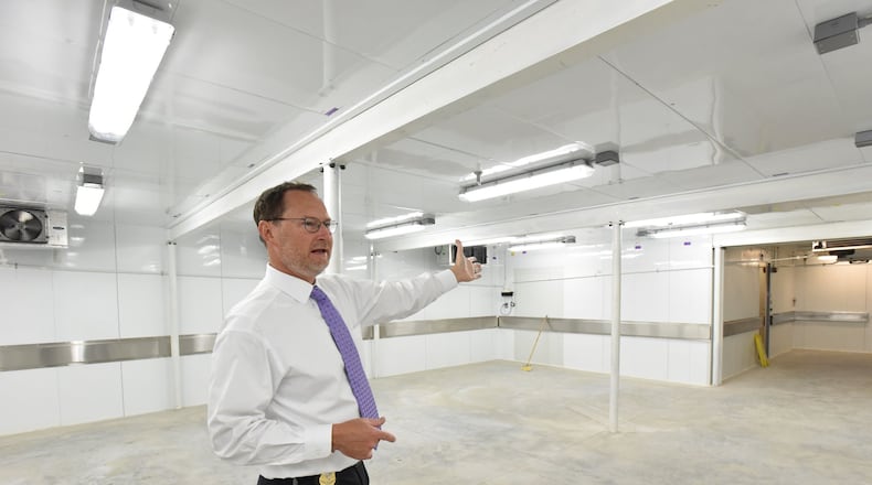 September 6, 2017 Decatur - J. Bahan Rich, Deputy Director of GBI Public Affairs Office, shows new morgue cooler in GBI Medical Examiner Annex on Wednesday, September 6, 2017. Bodies are stacking up at the state morgue. Soon it will more than double in size as workers complete an expansion but still the Georgia Bureau of Investigation struggles to get families to arrange for burial. HYOSUB SHIN / HSHIN@AJC.COM