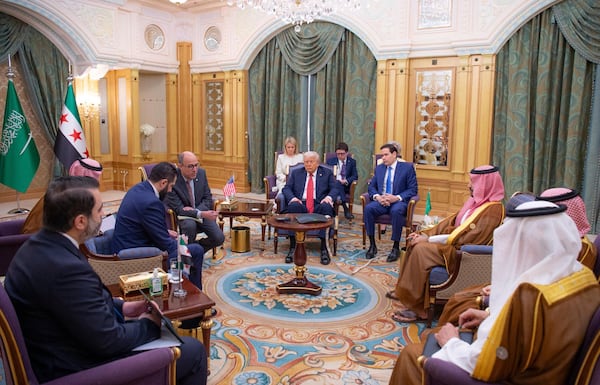 In this photo released by the Saudi Royal Palace, President Donald Trump, centre, and Secretary of State Marco Rubio , third from right, meet with Syria's interim President Ahmad al-Sharaa, second left, and with Saudi Crown Prince Mohammed bin Salman, second right, in Riyadh, Wednesday, May 14, 2025. (Bandar Aljaloud/Saudi Royal Palace via AP)