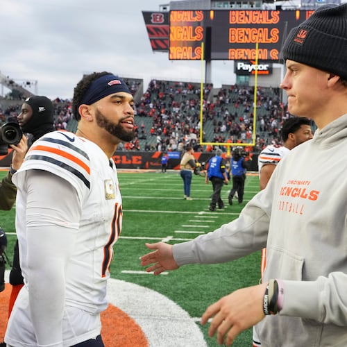 Cincinnati Bengals quarterback Joe Burrow (9), right, greets Chicago Bears quarterback Caleb Williams (18) after an NFL football game, Sunday, Nov. 2, 2025, in Cincinnati. (AP Photo/Jeff Dean)