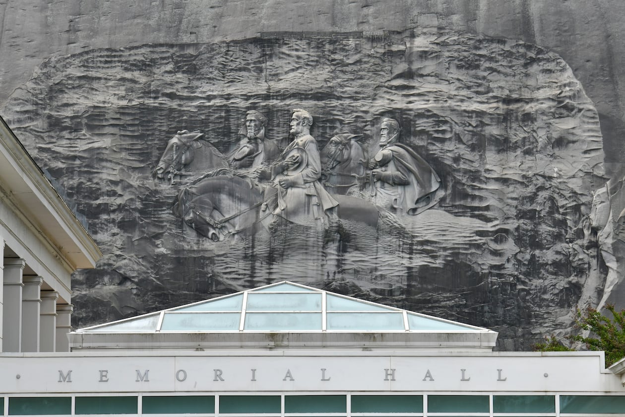 April 20, 2021 Stone Mountain - Memorial Hall (foreground) and Confederate Memorial Carving (background) at Stone Mountain Park on Tuesday, April 20, 2021. (Hyosub Shin / Hyosub.Shin@ajc.com)