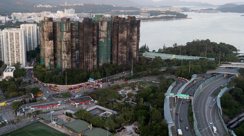 An aerial view of the burnt buildings after a deadly fire that started Wednesday at Wang Fuk Court, a residential estate in the Tai Po district of Hong Kong's New Territories, Friday, Nov. 28, 2025. (AP Photo/Ng Han Guan)