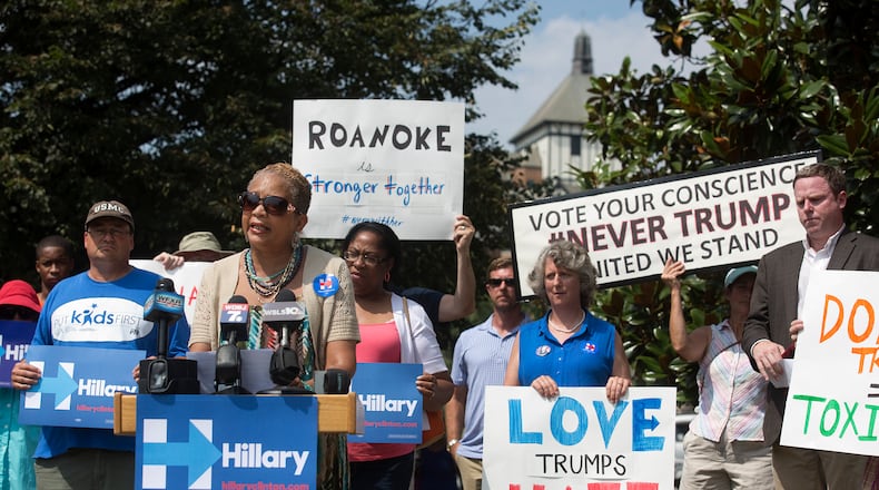 Anita Price, vice-mayor of Roanoke, Va., addresses the media and supporters during a news conference at the Wells Avenue Plaza to reject Republican presidential nominee Donald Trump and to support Democratic presidential candidate Hillary Clinton, Monday, July 25, 2016, in Roanoke. (Erica Yoon/The Roanoke Times via AP)