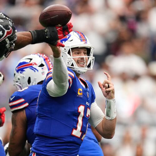 Buffalo Bills quarterback Josh Allen (17) throws an incomplete pass forced by Houston Texans defensive end Danielle Hunter, second from left, during the second half of an NFL football game, Sunday, Sept. 13, 2026, in Houston. (AP Photo/Ashley Landis)