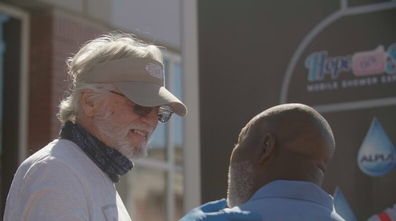 Hope thru Soap provides mobile showers, haircuts, clothing, food and connections to other resources for those experiencing homelessness in metro Atlanta. "We view our guests we serve as family. That is why we rotate to the same locations so that they know they can count on us to be back and check on them," said Executive Director Megan VandeBogert. Courtesy of Hope thru Soap