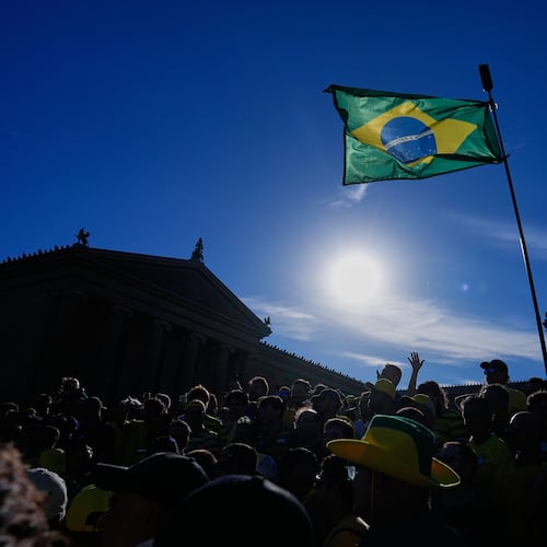 Fans of Brazil cheer as they gather at the Rocky Steps ahead of their team's World Cup group C soccer match against Haiti in Philadelphia, Thursday, June 18, 2026. (AP Photo/Petr David Josek)