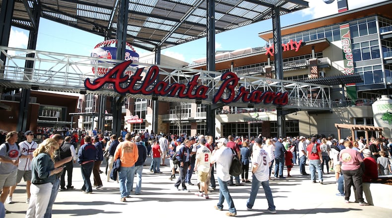 Fans head into SunTrust Park for the Braves-Yankees exhibition game Friday night. JASON GETZ / SPECIAL