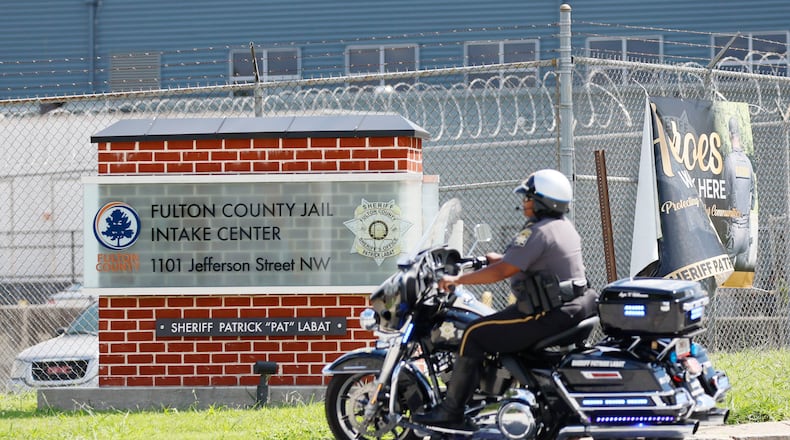 A police motorcycle is seen entering the Fulton County Jail in Atlanta on Thursday, Aug. 16, 2023. (Miguel Martinez/AJC)
