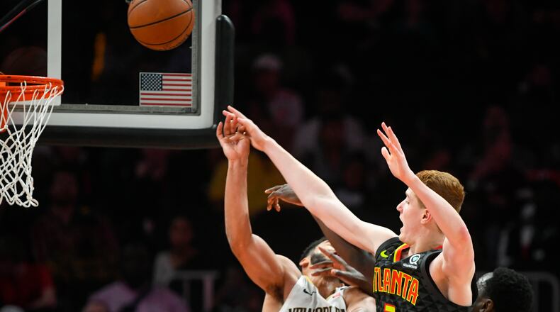 Atlanta Hawks guard Kevin Huerter (3) shoots as New Orleans Pelicans guard Kenrich Williams defends during the second half Sunday March 10, 2019, in Atlanta. The Hawks won 128-116.