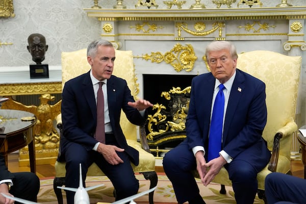 Canadian Prime Minister Mark Carney (left) and U.S. President Donald Trump hold a news conference at the White House on Tuesday, Oct. 7, 2025, in Washington, D.C. (Adrian Wyld/The Canadian Press via AP)