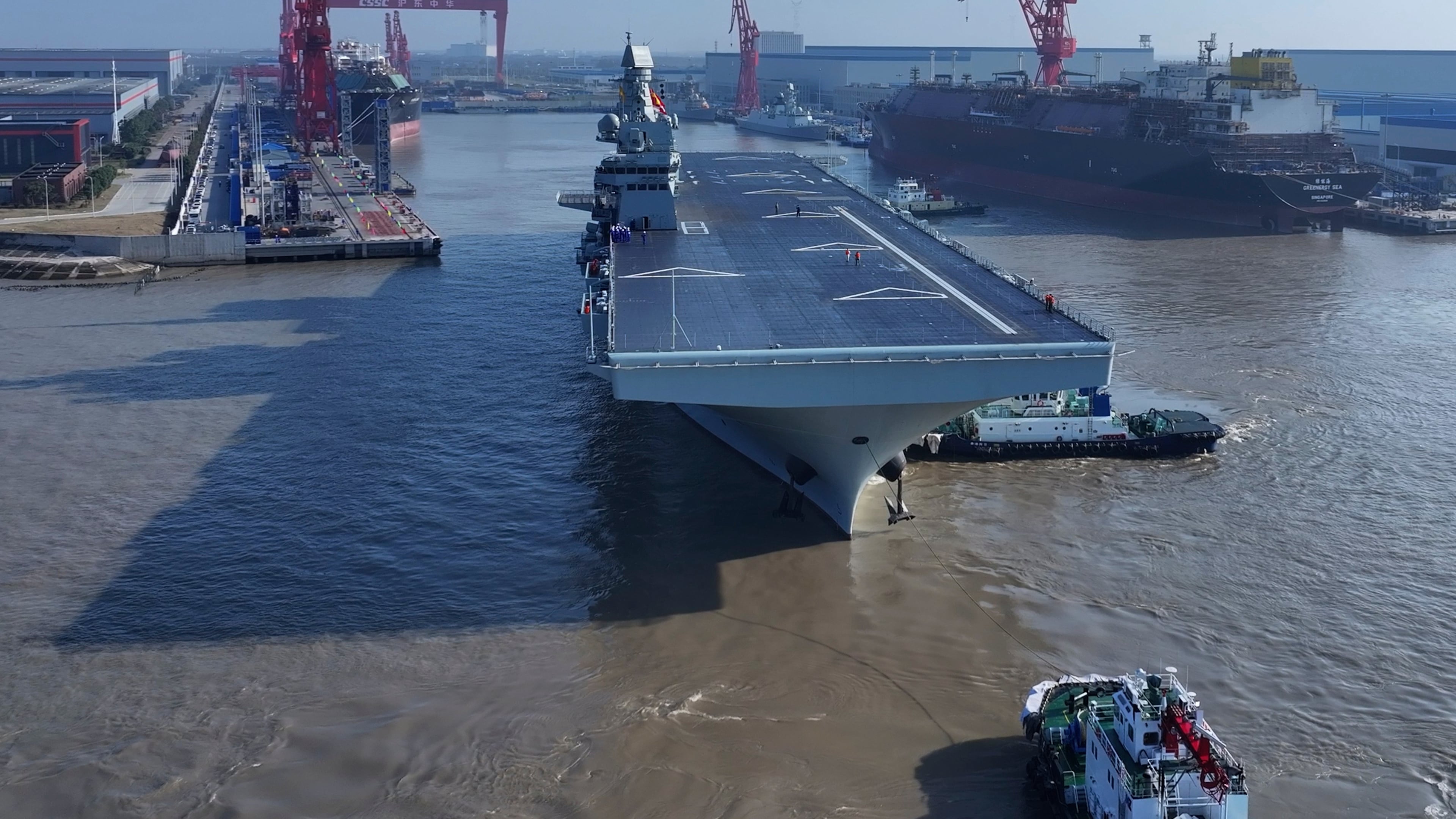 In this photo released by Xinhua News Agency, China's first Type 076 amphibious assault ship, PLANS Sichuan, sets sail from the port of Hudong-Zhonghua Shipbuilding (Group) Co., Ltd. in Shanghai on Friday, Nov. 14, 2025.(Zhang Liang/Xinhua via AP)
