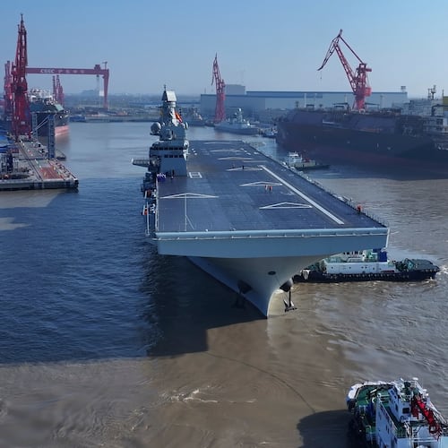 In this photo released by Xinhua News Agency, China's first Type 076 amphibious assault ship, PLANS Sichuan, sets sail from the port of Hudong-Zhonghua Shipbuilding (Group) Co., Ltd. in Shanghai on Friday, Nov. 14, 2025.(Zhang Liang/Xinhua via AP)