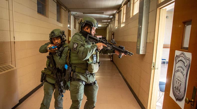 FILE-- Atlanta's SWAT team trains for an active shooter scenario at the old police academy in Atlanta on Tuesday, December 14, 2021.  STEVE SCHAEFER FOR THE ATLANTA JOURNAL-CONSTITUTION