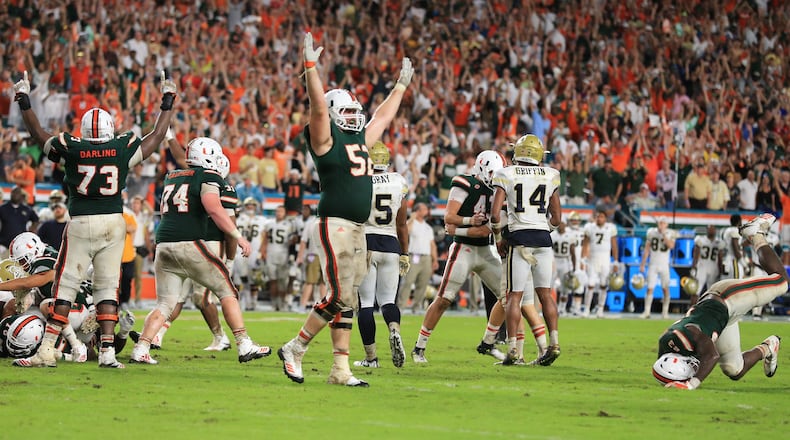 There's something familiar - Miami players celebrate Saturday after beating Georgia Tech, this time on a field goal with four seconds left. (Al Diaz/Miami Herald/TNS)