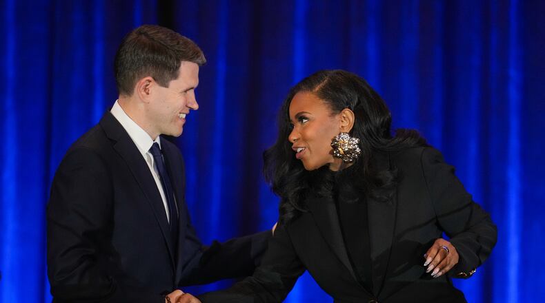 Texas state Rep. James Talarico, D-Austin, left, shakes hands with Rep. Jasmine Crockett, D-Texas, prior a debate during the Texas AFL-CIO Committee on Political Education Convention, Saturday, Jan. 24, 2026, in Georgetown, Texas. (Bob Daemmrich/Texas Tribune via AP, Pool)