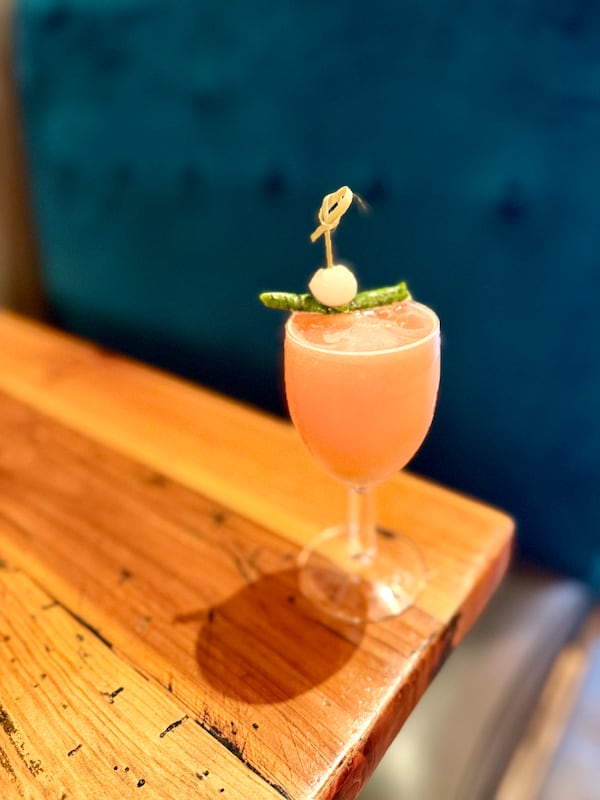 Kindred's Caprese Reviver has a base of tomato-infused quinquina and sips much like an herbal caprese salad in a glass. (Angela Hansberger for the AJC)