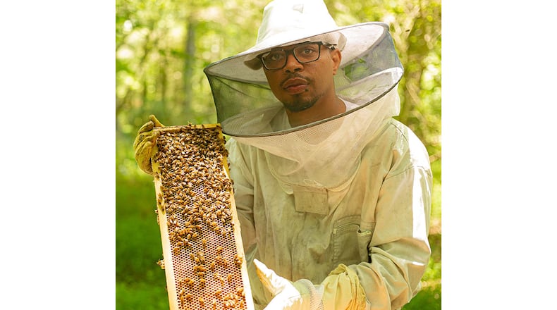 Armond Wilbourn of Noble Honey Company keeps 26 honeybee hives in a bee yard in Palmetto. /
Courtesy of Noble Honey Company