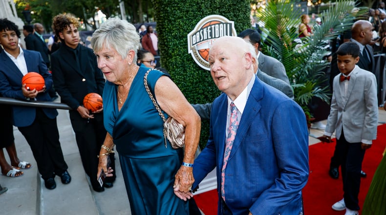 Veteran NBA referee and 2026 inductee Joey Crawford, right, recognizes his image on the columns of Symphony Hall as he enters the 2026 Naismith Basketball Hall of Fame induction ceremony Saturday, Aug. 15, 2026, in Springfield, Mass. (AP Photo/Rusty Jones)