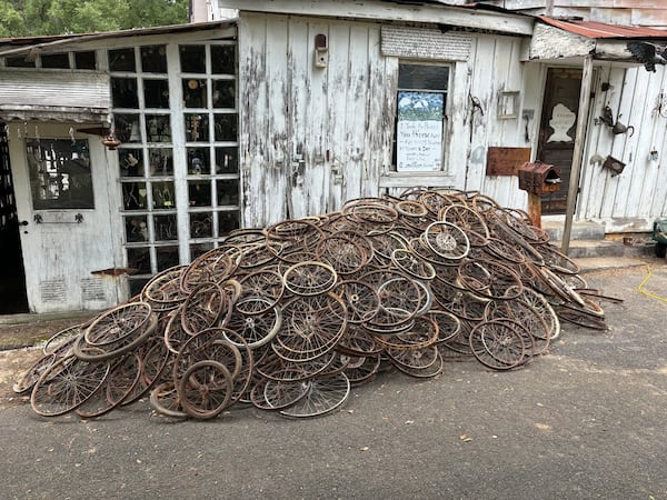When contractor Eddy Willingham shimmied into the crawl underneath Howard Finster's World's Folk Art Church to assess the foundation, he found a mountain of old bicycle rims. Courtesy of Eddy Willingham