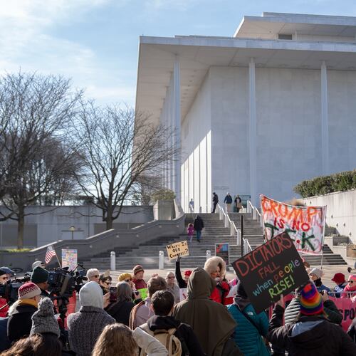 Demonstrators protest a Trump-appointed board's decision to add President Donald Trump's name to the John F. Kennedy Memorial Center for the Performing Arts, Saturday, Dec. 20, 2025, in Washington. (AP Photo/Julia Demaree Nikhinson)
