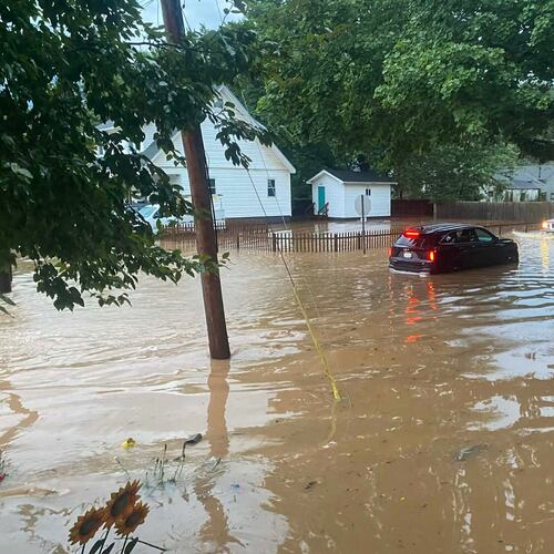 This photo provided by Joe Kinzer shows flash flooding Tuesday, July 21, 2026, in Buckhannon, W.Va. (Joe Kinzer via AP)