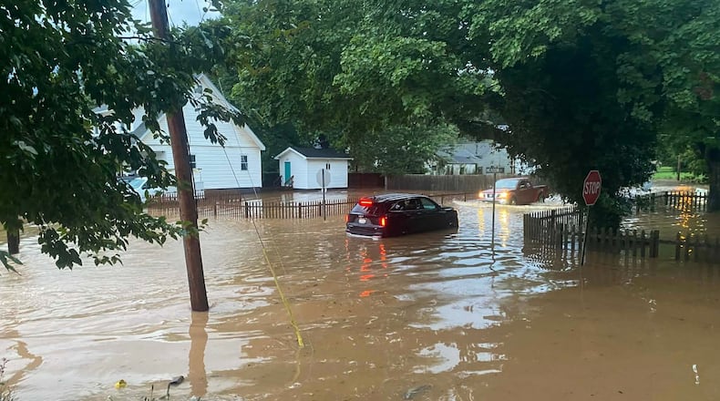 This photo provided by Joe Kinzer shows flash flooding Tuesday, July 21, 2026, in Buckhannon, W.Va. (Joe Kinzer via AP)
