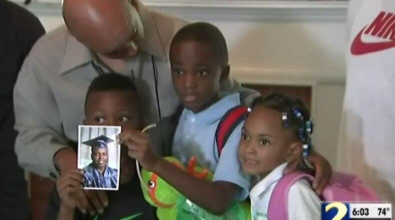 Some of Larry Grigsby’s blood was on his children, Elijah (center) and Alisha (far right), Grigsby’s cousin said. He was shot and killed early Sun., July 31, 2016, in Cobb County. (Credit: Channel 2 Action News)
