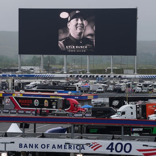 An in memoriam photo of former driver Kyle Busch is displayed on the video board of the backstretch at Charlotte Motor Speedway, Friday, May 22, 2026, in Charlotte, N.C. (AP Photo/Matt Kelley)