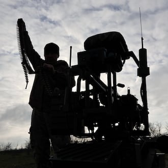 In this photo, provided by Ukraine's 65th Mechanized Brigade press service, a soldier tests land drones in Zaporizhzhia region, Ukraine, Saturday, Dec. 6, 2025, (Andriy Andriyenko/Ukraine's 65th Mechanized Brigade via AP)