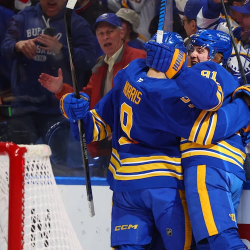 Buffalo Sabres right wing Josh Doan, right, celebrates his goal with center Josh Norris, during the first period in Game 1 of a second-round NHL hockey Stanley Cup playoff series, Wednesday, May 6, 2026, in Buffalo, N.Y. (AP Photo/Jeffrey T. Barnes)