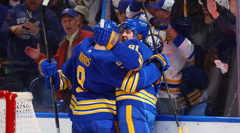 Buffalo Sabres right wing Josh Doan, right, celebrates his goal with center Josh Norris, during the first period in Game 1 of a second-round NHL hockey Stanley Cup playoff series, Wednesday, May 6, 2026, in Buffalo, N.Y. (AP Photo/Jeffrey T. Barnes)