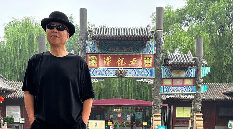 In this photo taken June 2023 and released by Zhao Yaliang, Chinese artist Gao Zhen poses for a photo in Jinan in northern China's Shandong province. (Zhao Yaliang via AP)